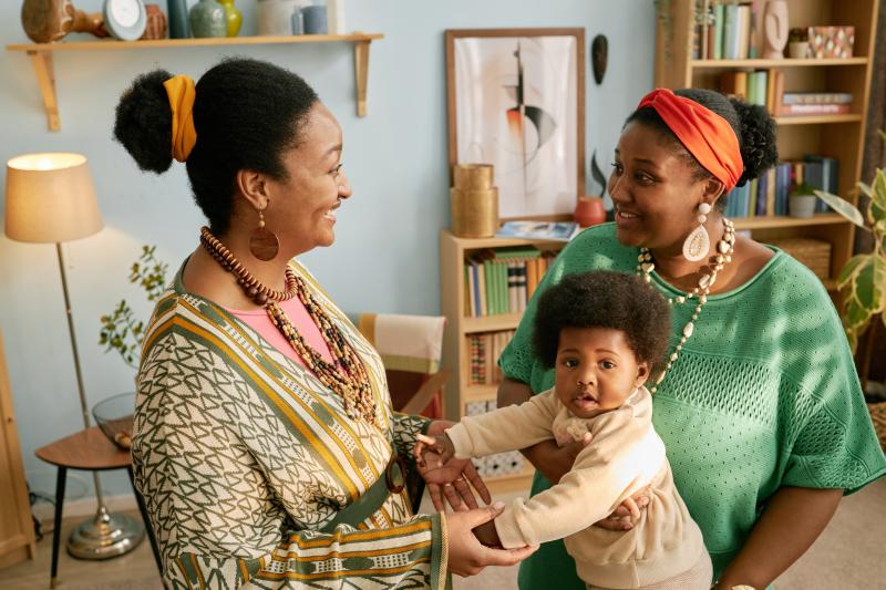 A doula visits a new mom in her home